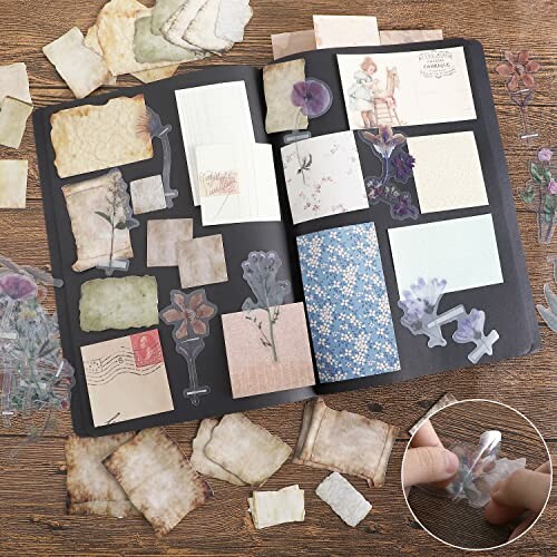 Open scrapbook with vintage papers and pressed flowers.