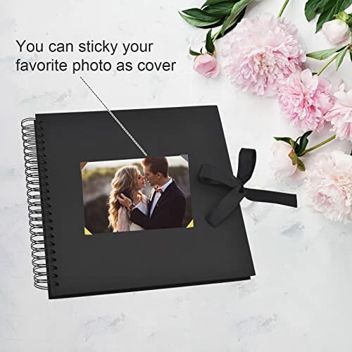 Black photo album with flowers and customizable cover option.