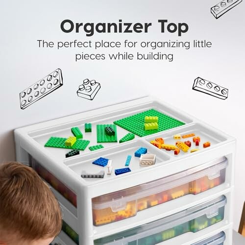 Lego organizer top with building pieces and storage drawers.