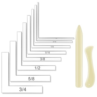 Bone folding tools and paper scoring guides in various sizes.