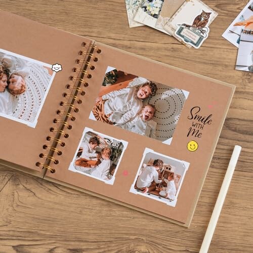 Scrapbook with photos on a wooden table