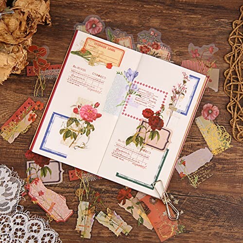 Open scrapbook with vintage floral designs and decorative papers.